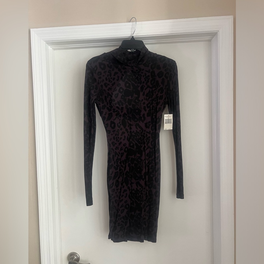 GUESS size small high neck, open back, long sleeve black leopard mini dress